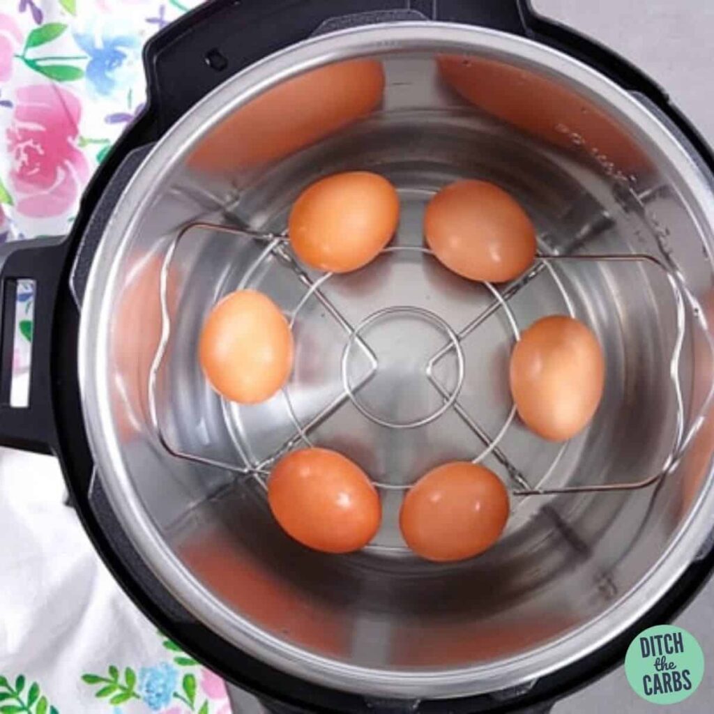 an Instant Pot cooking boiled eggs in a basket
